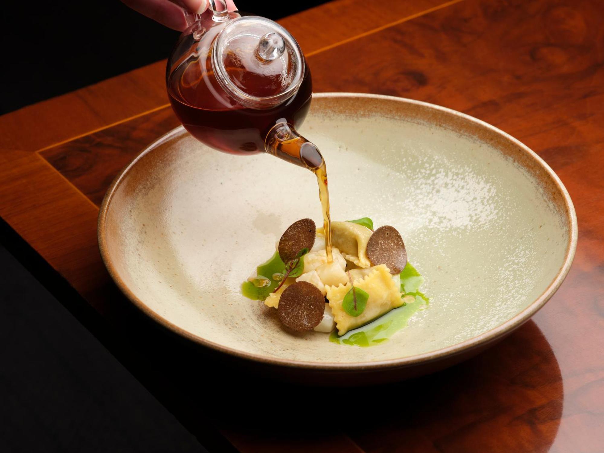 The Stafford London Hotel Exterior foto Soy sauce being poured onto a dish